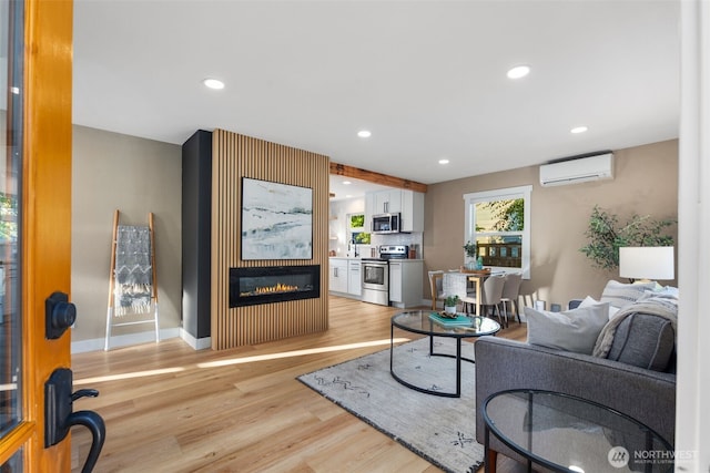 3130 SW 97th St, Seattle, WA 98126 - living room with a wall unit AC, light wood-style floors, a fireplace, and recessed lighting