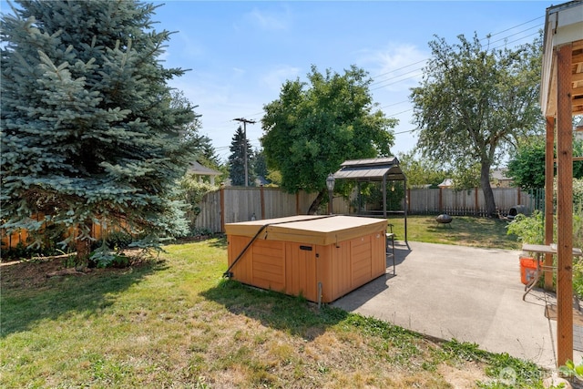 701 13th St SE, Puyallup, WA 98372 - fenced backyard featuring a hot tub, a patio area, an outdoor fire pit, and a gazebo