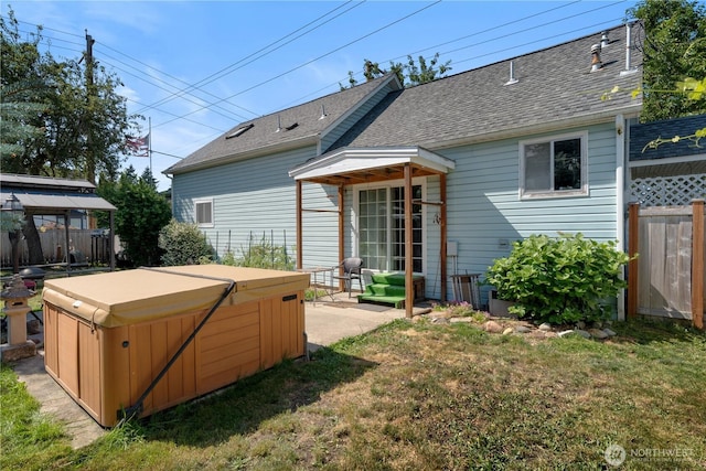 701 13th St SE, Puyallup, WA 98372 - rear view of house featuring a hot tub and roof with shingles