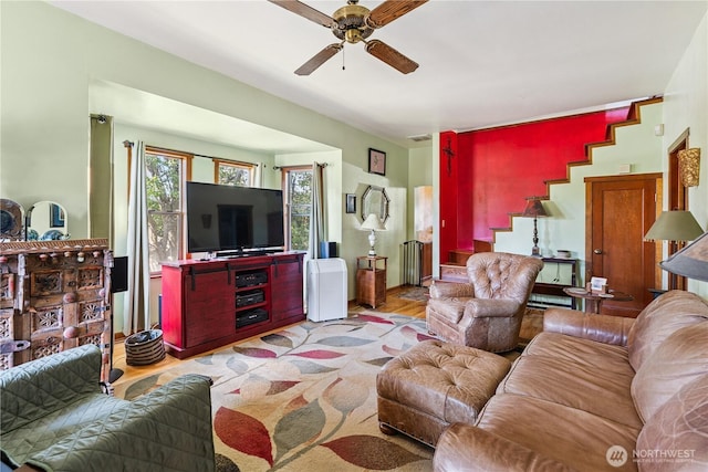 701 13th St SE, Puyallup, WA 98372 - living area featuring a ceiling fan, stairway, and light wood-style floors