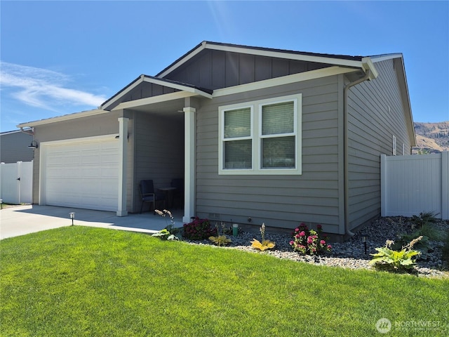 420 Hammond Ln, Rock Island, WA 98850 - view of front of house with an attached garage, driveway, and board and batten siding