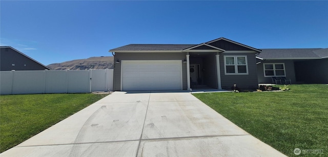 420 Hammond Ln, Rock Island, WA 98850 - ranch-style home with concrete driveway, a garage, a gate, and a mountain view