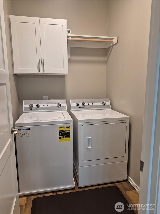 420 Hammond Ln, Rock Island, WA 98850 - laundry room featuring separate washer and dryer, cabinet space, and wood finished floors