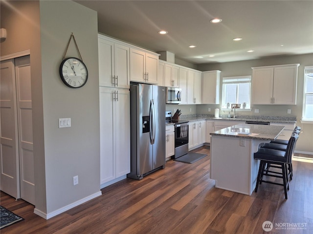 420 Hammond Ln, Rock Island, WA 98850 - kitchen featuring appliances with stainless steel finishes, recessed lighting, dark wood-style flooring, and white cabinets