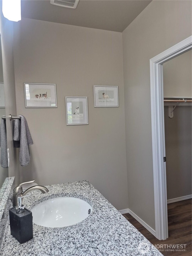 420 Hammond Ln, Rock Island, WA 98850 - bathroom featuring wood finished floors and vanity