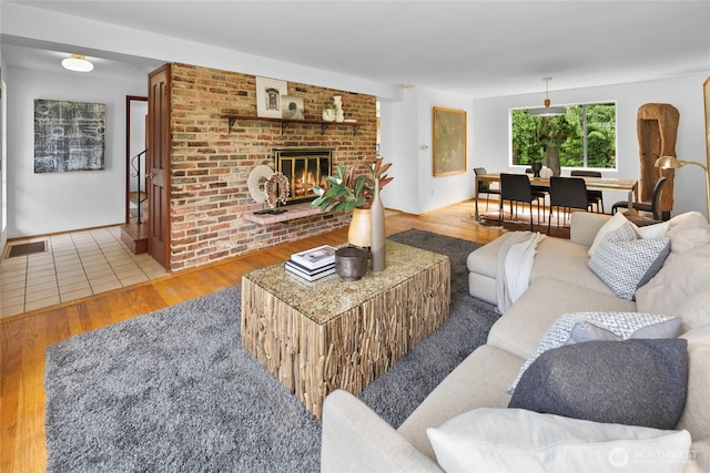 317NW 177th St, Shoreline, WA 98177 - living area featuring wood finished floors and a fireplace
