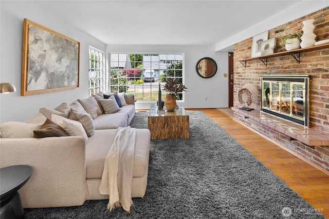317NW 177th St, Shoreline, WA 98177 - living room with wood finished floors and a brick fireplace
