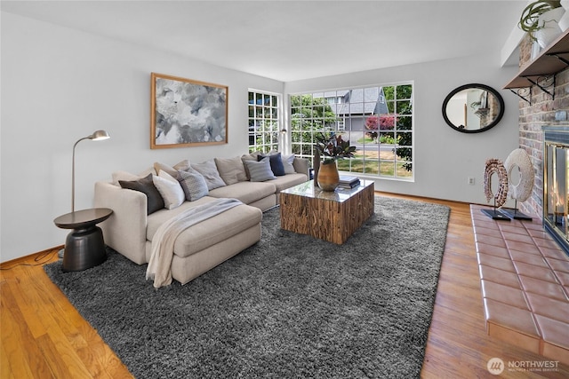 317NW 177th St, Shoreline, WA 98177 - living area featuring wood finished floors and a glass covered fireplace