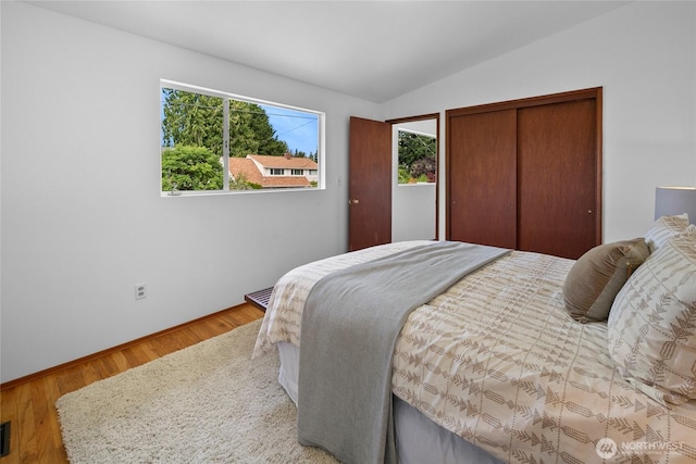 317NW 177th St, Shoreline, WA 98177 - bedroom with lofted ceiling, wood finished floors, and a closet