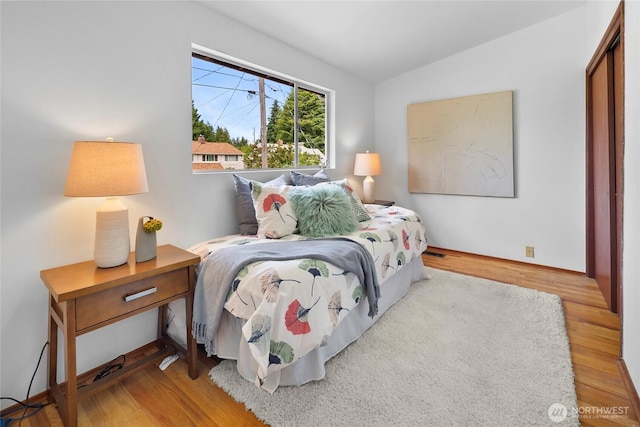 317NW 177th St, Shoreline, WA 98177 - bedroom with lofted ceiling and wood finished floors