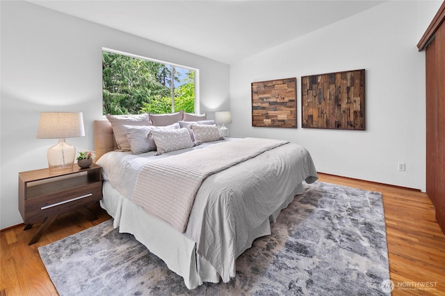 317NW 177th St, Shoreline, WA 98177 - bedroom featuring vaulted ceiling and wood finished floors