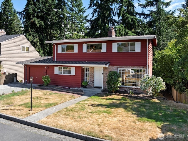 317NW 177th St, Shoreline, WA 98177 - view of front facade with a standing seam roof, a chimney, an attached garage, a metal roof, and brick siding