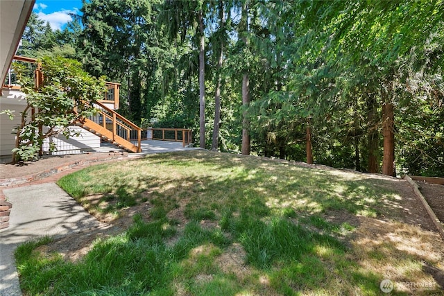 317NW 177th St, Shoreline, WA 98177 - view of grassy yard featuring stairs and a wooden deck