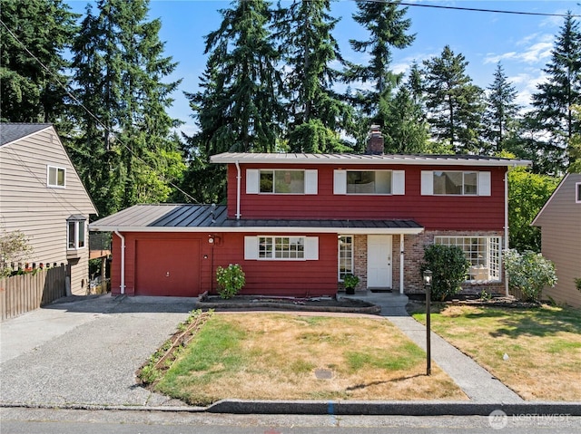 317NW 177th St, Shoreline, WA 98177 - traditional-style home featuring a standing seam roof, a garage, a metal roof, asphalt driveway, and a chimney