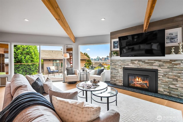 3406 SW Manning St, Seattle, WA 98126 - living area featuring beam ceiling, a glass covered fireplace, wood finished floors, and recessed lighting