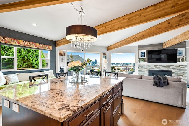 3406 SW Manning St, Seattle, WA 98126 - kitchen featuring open floor plan, light wood-type flooring, light stone countertops, recessed lighting, and a chandelier