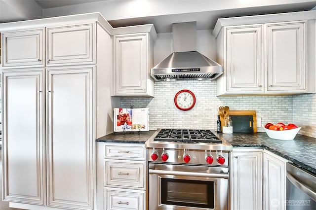 3406 SW Manning St, Seattle, WA 98126 - kitchen featuring wall chimney exhaust hood, high end appliances, white cabinets, and tasteful backsplash