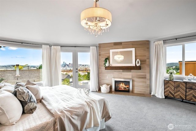 3406 SW Manning St, Seattle, WA 98126 - carpeted bedroom with access to exterior, a large fireplace, a chandelier, and french doors