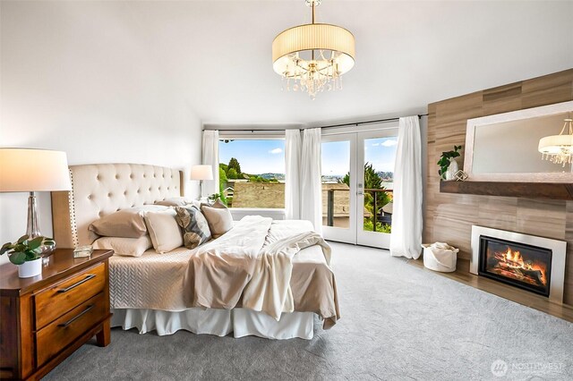 3406 SW Manning St, Seattle, WA 98126 - carpeted bedroom with a chandelier, access to exterior, and a fireplace