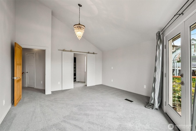 3406 SW Manning St, Seattle, WA 98126 - carpeted empty room with vaulted ceiling and a chandelier