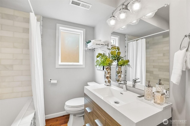 3406 SW Manning St, Seattle, WA 98126 - bathroom with vanity, shower / bathtub combination with curtain, and wood finished floors