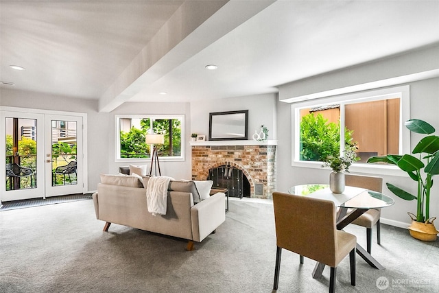 3406 SW Manning St, Seattle, WA 98126 - carpeted living area featuring healthy amount of natural light, recessed lighting, a brick fireplace, and french doors