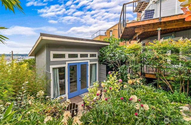3406 SW Manning St, Seattle, WA 98126 - view of home's exterior with french doors and a deck