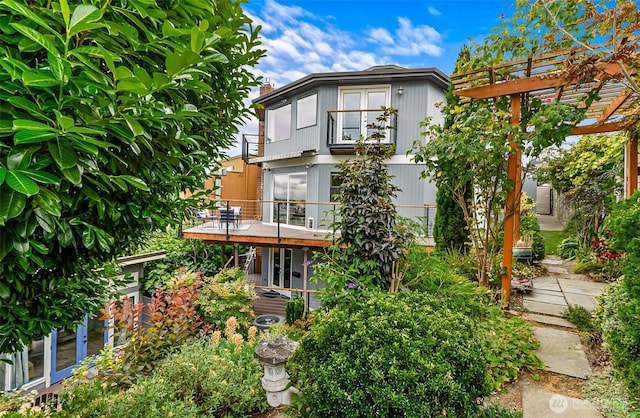 3406 SW Manning St, Seattle, WA 98126 - back of house featuring a wooden deck and a pergola