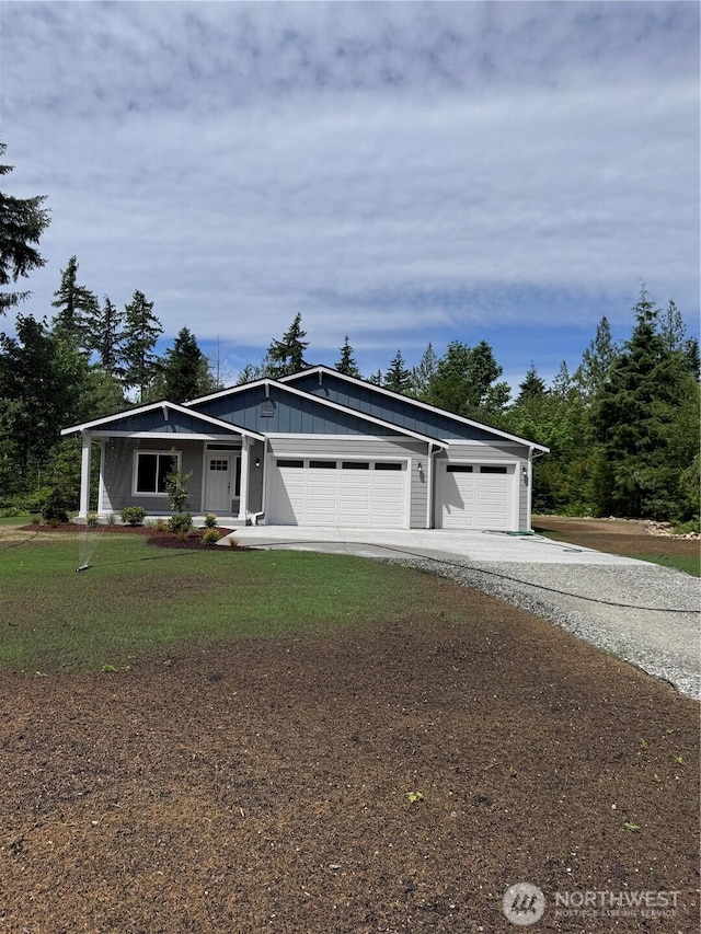 8630 Trillium Ln, Concrete, WA 98237 - view of front of property featuring driveway, a garage, and a front lawn