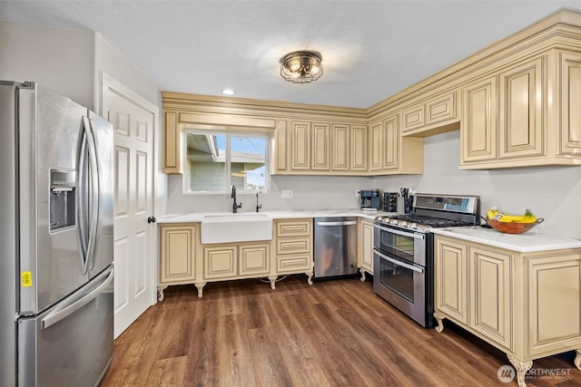 19621 N Glade Rd, Mesa, WA 99343 - kitchen featuring appliances with stainless steel finishes, cream cabinets, light countertops, and dark wood-style flooring