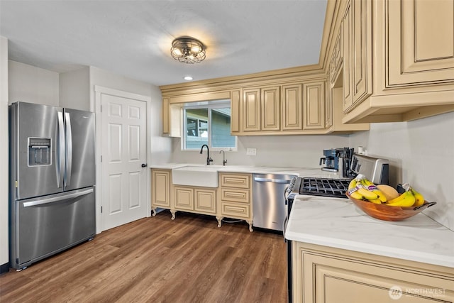 19621 N Glade Rd, Mesa, WA 99343 - kitchen featuring stainless steel appliances, cream cabinetry, dark wood-style floors, and light stone counters