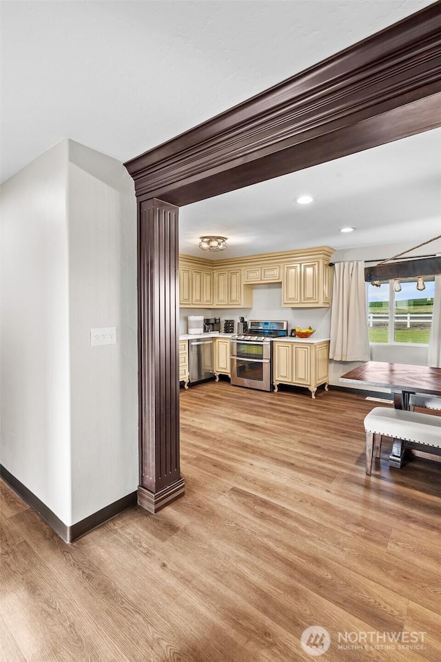 19621 N Glade Rd, Mesa, WA 99343 - kitchen featuring appliances with stainless steel finishes, light wood-style flooring, light countertops, cream cabinets, and recessed lighting