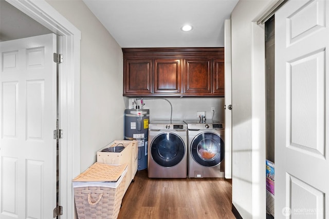 19621 N Glade Rd, Mesa, WA 99343 - washroom with independent washer and dryer, water heater, wood finished floors, recessed lighting, and cabinet space