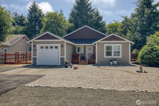 789 Island Cir SE, Ocean Shores, WA 98569 - single story home featuring covered porch, asphalt driveway, and an attached garage