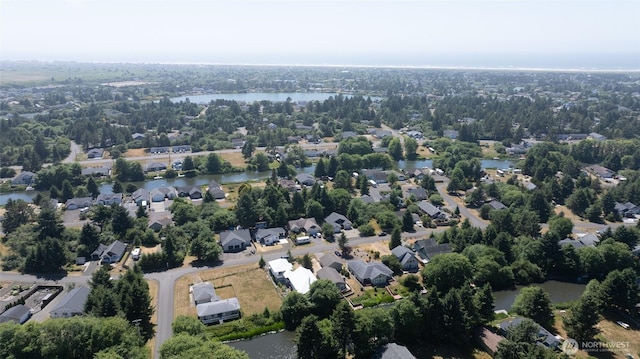 789 Island Cir SE, Ocean Shores, WA 98569 - aerial view of property and surrounding area featuring a nearby body of water and nearby suburban area