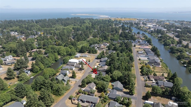 789 Island Cir SE, Ocean Shores, WA 98569 - aerial overview of property's location featuring a nearby body of water and nearby suburban area