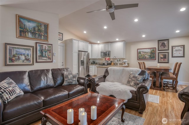 789 Island Cir SE, Ocean Shores, WA 98569 - living room with ceiling fan, light wood-style floors, recessed lighting, and vaulted ceiling