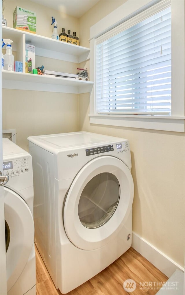 789 Island Cir SE, Ocean Shores, WA 98569 - laundry room featuring washing machine and dryer and light wood finished floors