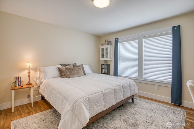 789 Island Cir SE, Ocean Shores, WA 98569 - bedroom featuring baseboards and wood finished floors