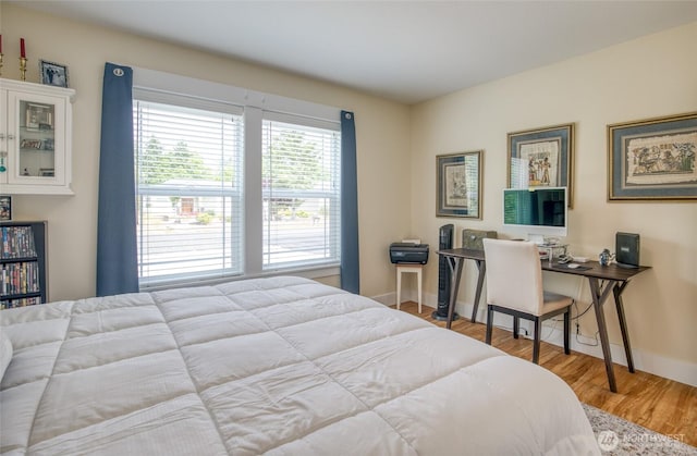 789 Island Cir SE, Ocean Shores, WA 98569 - bedroom featuring baseboards and wood finished floors