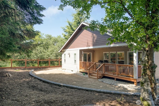 789 Island Cir SE, Ocean Shores, WA 98569 - rear view of house with a wooden deck, crawl space, and a patio area