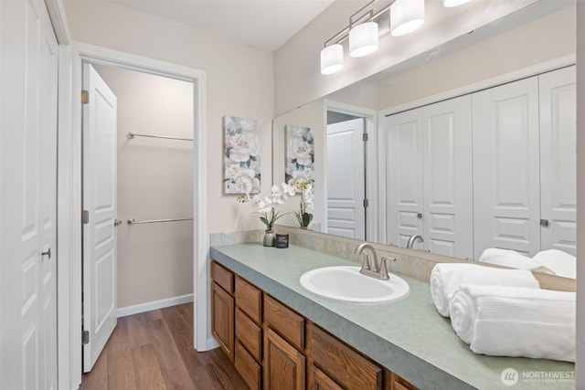 300 N Sequim Ave Unit 15, Sequim, WA 98382 - bathroom with a closet, vanity, and wood finished floors