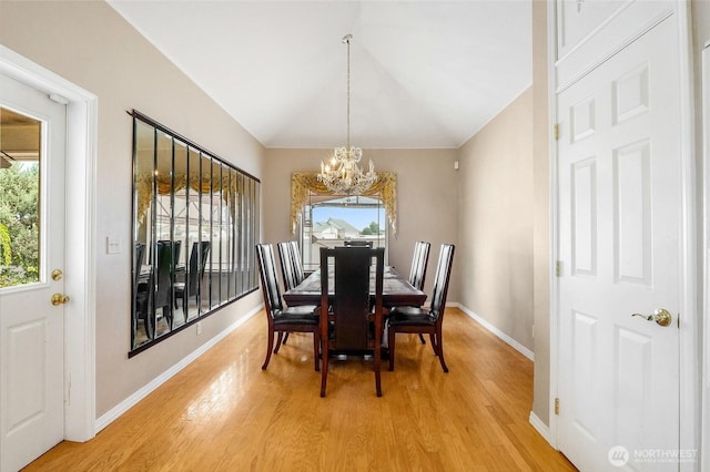 9460 Albert Way SE, Moses Lake, WA 98837 - dining space featuring a chandelier, light wood-style flooring, and vaulted ceiling
