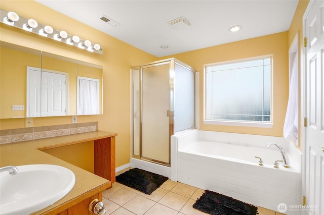 9460 Albert Way SE, Moses Lake, WA 98837 - bathroom featuring tile patterned floors, a garden tub, a stall shower, vanity, and recessed lighting
