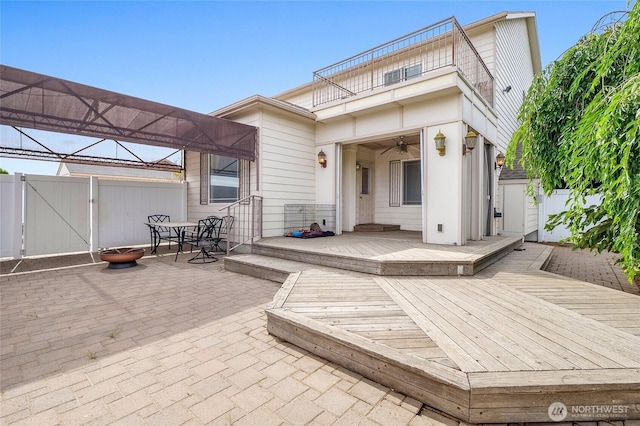 9460 Albert Way SE, Moses Lake, WA 98837 - wooden deck featuring a gate, a patio, and outdoor dining space
