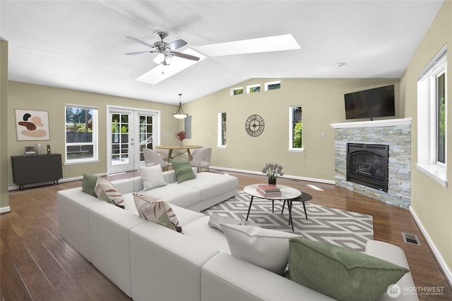 22526 87th Pl W, Edmonds, WA 98026 - living area featuring a skylight, lofted ceiling, wood finished floors, and a stone fireplace