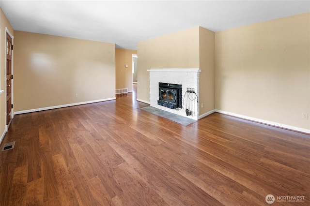 22526 87th Pl W, Edmonds, WA 98026 - unfurnished living room featuring wood finished floors and a fireplace