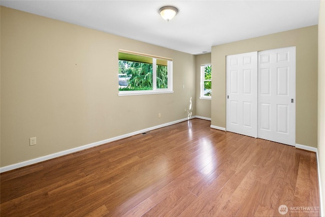 22526 87th Pl W, Edmonds, WA 98026 - unfurnished bedroom with wood finished floors and a closet