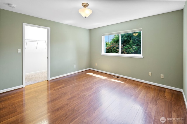 22526 87th Pl W, Edmonds, WA 98026 - unfurnished room with a smoke detector and wood finished floors