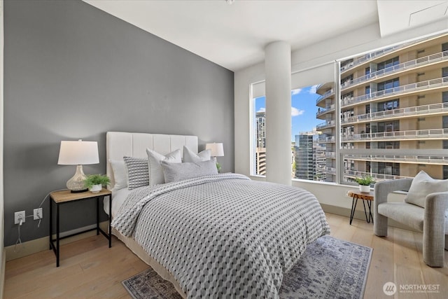 737 Olive Way Unit 1903, Seattle, WA 98101 - bedroom featuring wood finished floors
